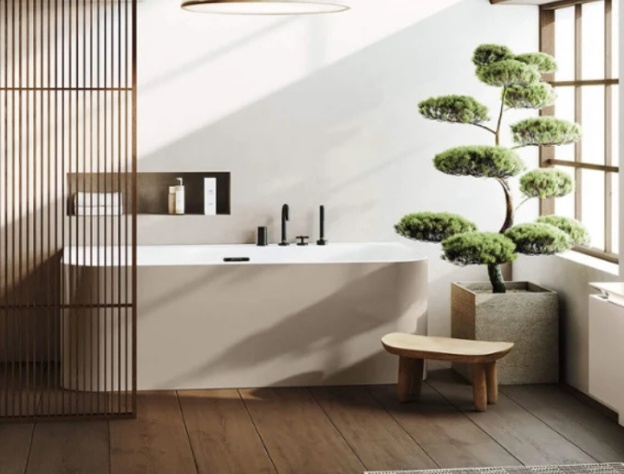 Lifestyle image of a wellness bathroom with single ended bathtub and niche